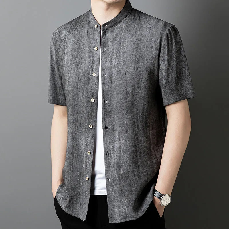 Men's loose grey linen cardigan shirt with a stand collar on a hanger.