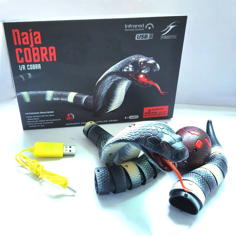 Automatic electronic snake cat toy with segmented plastic body on a floor