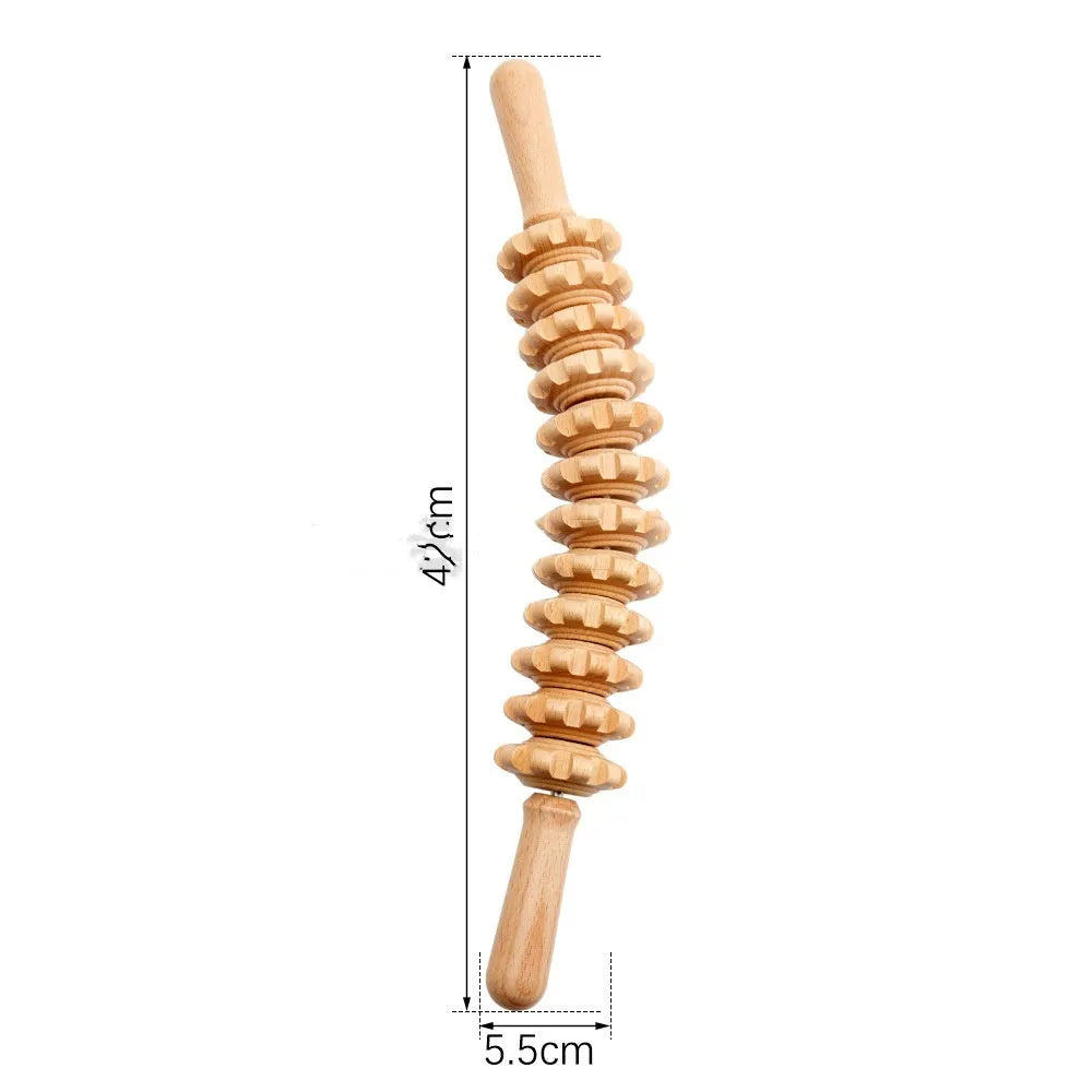 A selection of natural beechwood massage rollers including T-shaped and multi-wheel designs on a wooden surface.