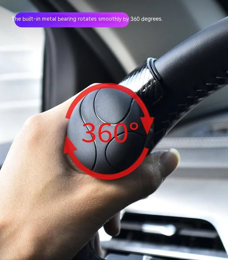 Steering wheel assist ball with silicone exterior and metal bearing for single-hand driving control