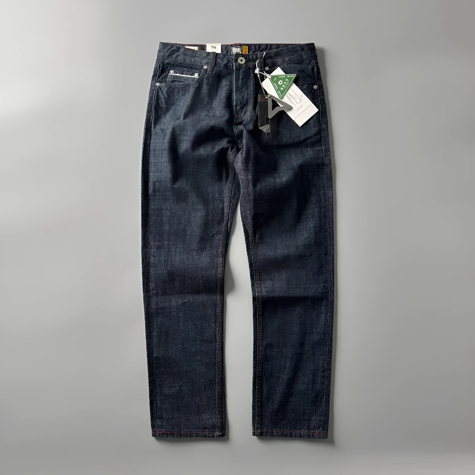 Men's straight-leg cotton denim trousers in a primary colour wash, showing mid-waist fit.