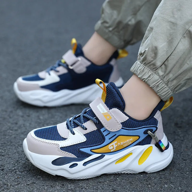 Boys' dark blue and black sports running shoes with velcro strap and mesh upper.