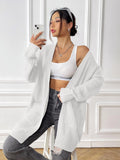 Women's double pocket casual cardigan sweater in dark green, loose mid-length fit.