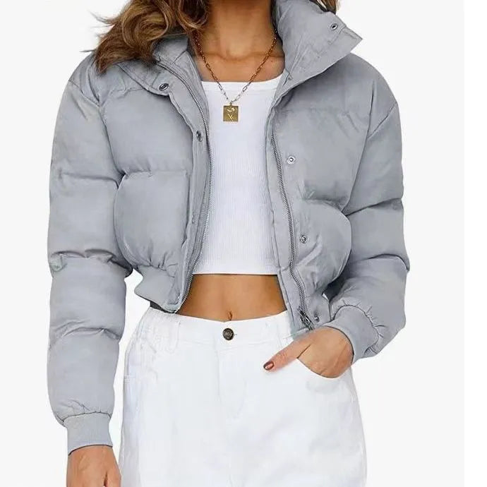 Women's loose blue polyester jacket with long sleeves shown front view
