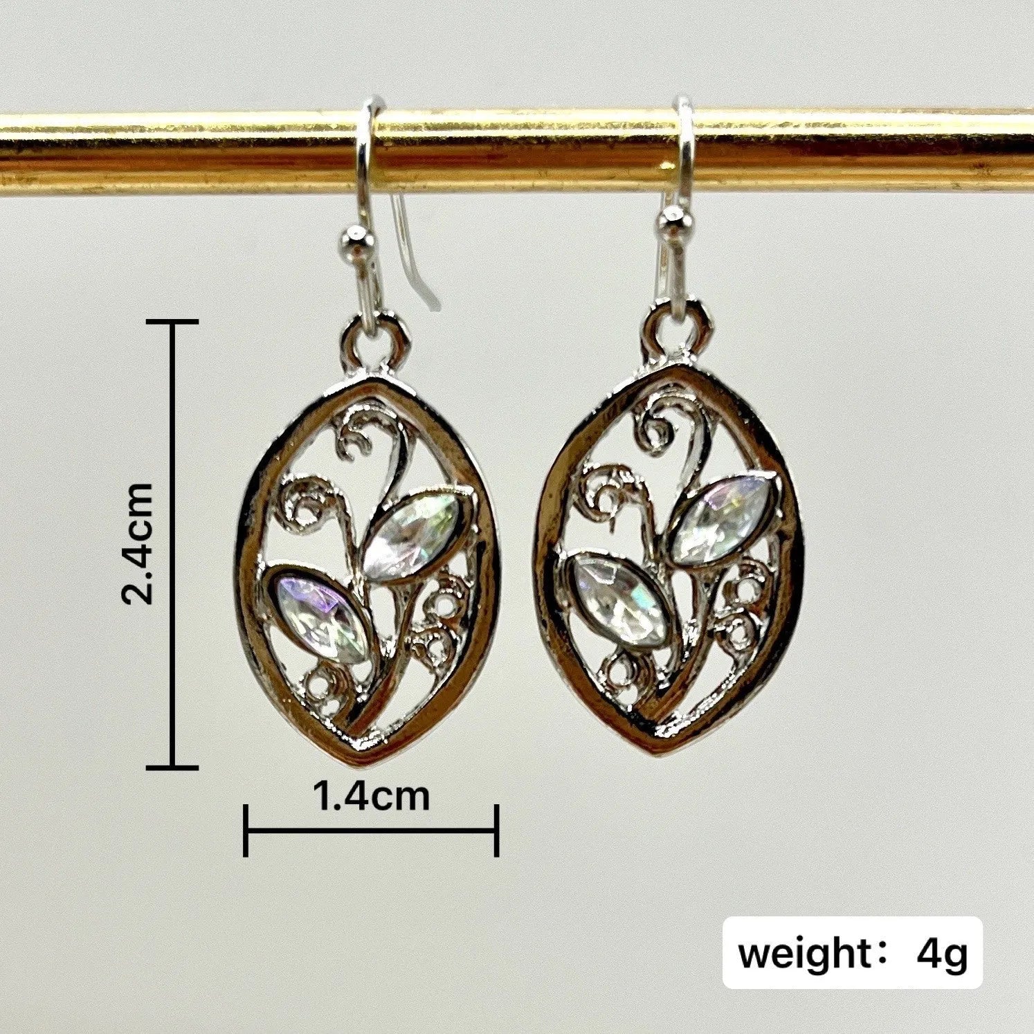 Silver leaf-shaped earrings with colourful moonstone stones embedded in alloy design
