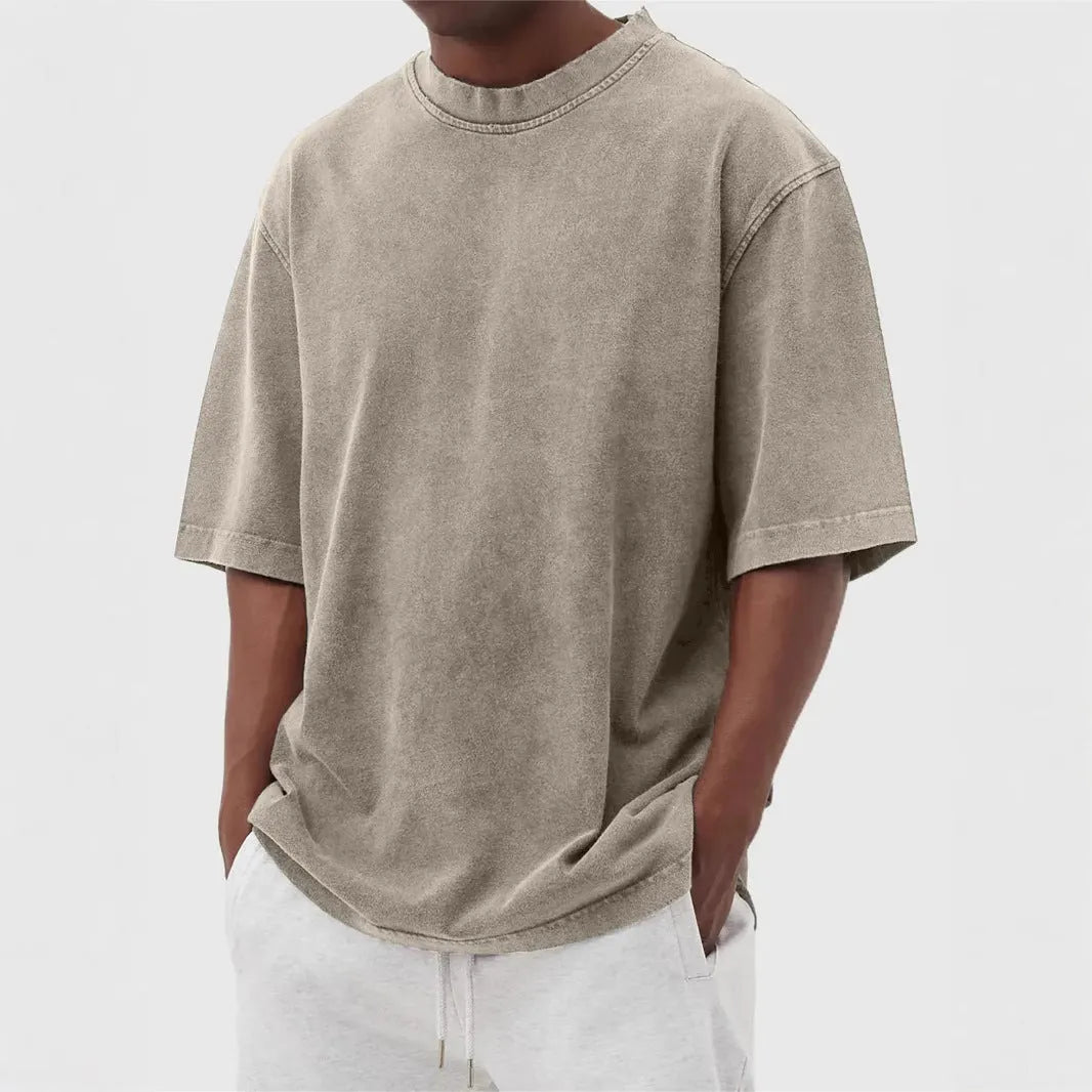 Men's distressed stone wash pullover T-shirt in loose fit with half sleeves available in multiple solid colours
