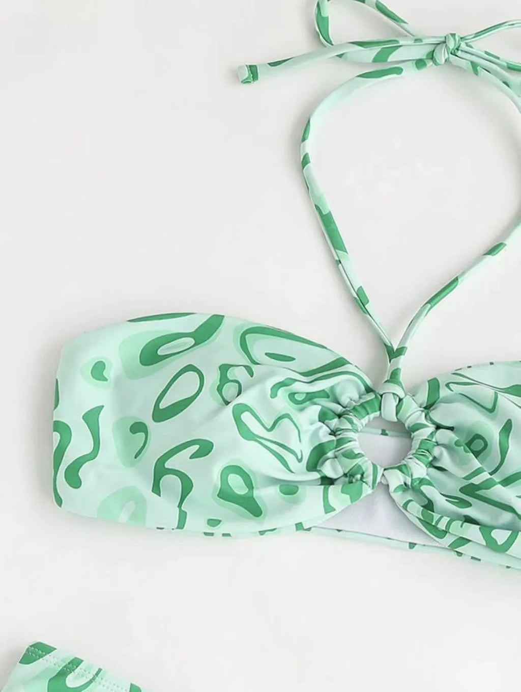Green floral bandeau bikini swimsuit with backless design and matching briefs