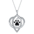 Copper pendant necklace with dog and cat paw print design on a cross chain