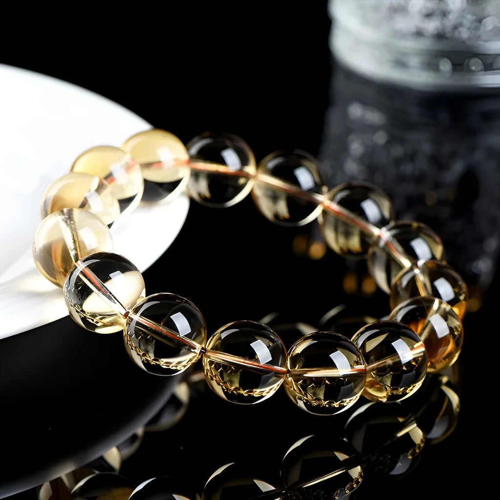 Natural citrine scattered beads ball bracelet showing polished yellow gemstone balls on a string, with colour grade and size options.