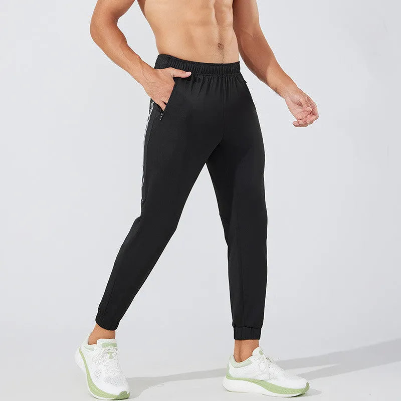Men's black polyester running pants with mid waist design for exercise and sports