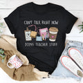 Black loose fit cotton T-shirt with short sleeves and round neck collar on hanger