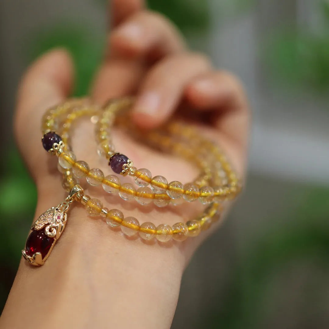 Natural gold rutilated quartz bracelet with three rings Chinese style design on wrist