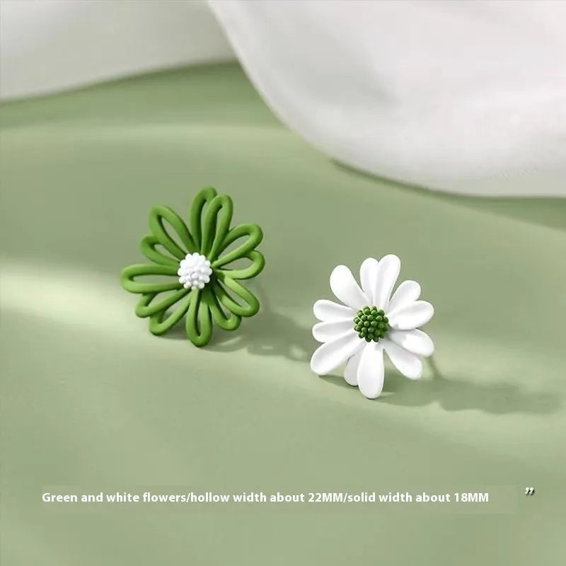 Cartoon style flower stud earrings made from alloy in blue and orange two-tone colours.