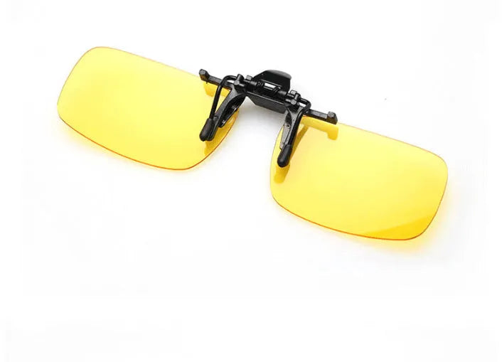 A pair of polycarbonate clip-on sunglasses for prescription glasses, shown in a dark green tint.