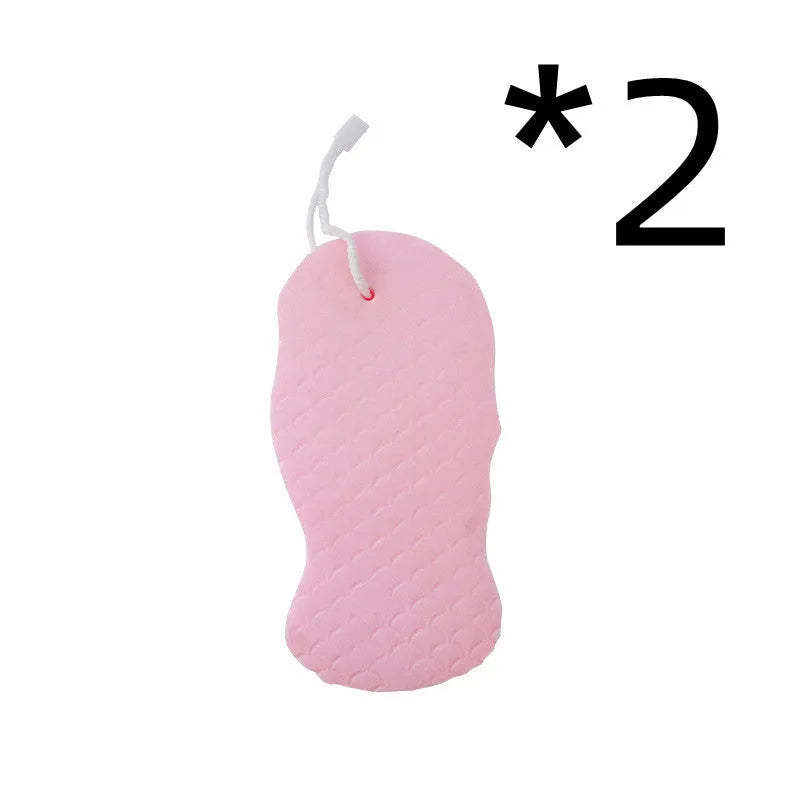 White 3D fish scale pattern bath sponge ball on a bathroom surface