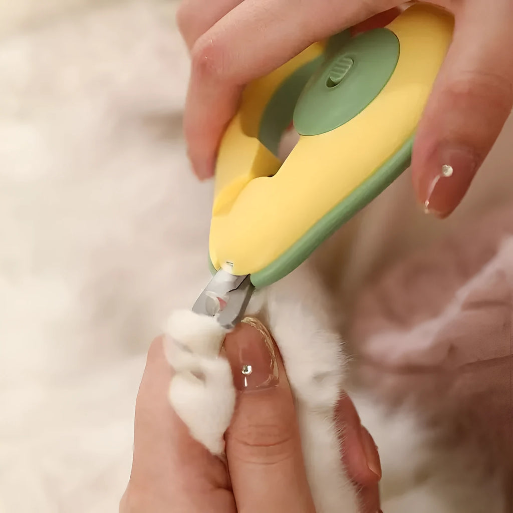 LED pet nail clipper for small dogs and cats with replacement blade in green colour