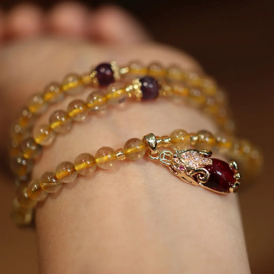 Natural gold rutilated quartz bracelet with three rings Chinese style design on wrist
