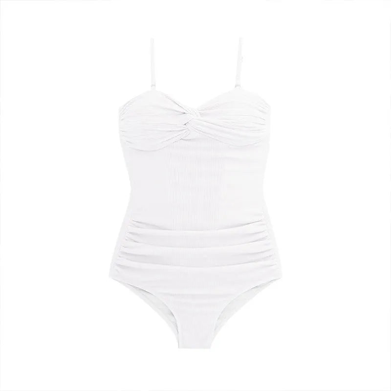 Women's black strapped jumpsuit one-piece swimsuit on a mannequin, side view.