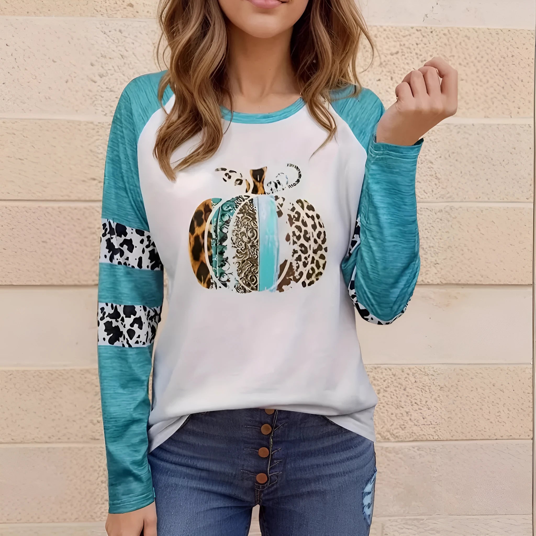 Sky blue long sleeve t-shirt with a large 3D digital printed Halloween pumpkin design on the front.