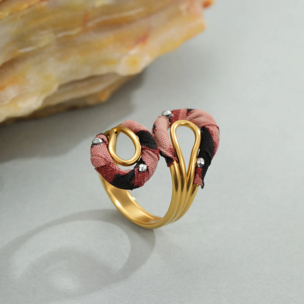 Leopard print geometric open mouth adjustable ring in stainless steel, showing heart shape on finger.
