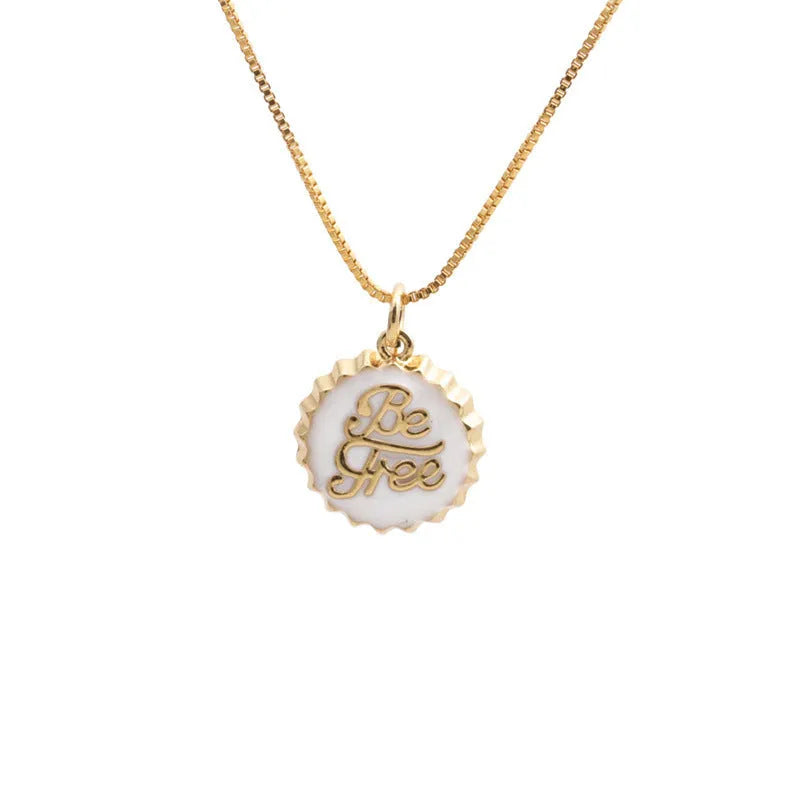 Copper bottle cap pendant necklace with gold plating on a box chain.