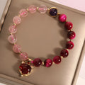 Simple strawberry crystal bracelet for women on a black elastic rope, 18cm long.