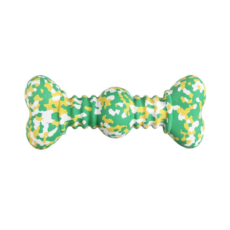 Green and white camouflage pattern natural rubber dog chew toy for large dogs on a wooden floor.