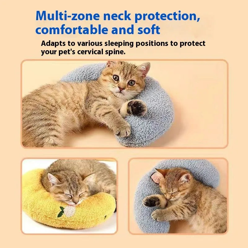 Blue U-shaped cat sleeping mat with moon design next to a yellow question mark shaped pet pillow.