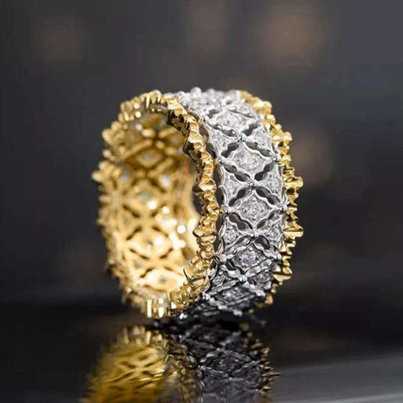 Two-tone gold geometric zircon ring on display showing round shape and electroplated copper construction