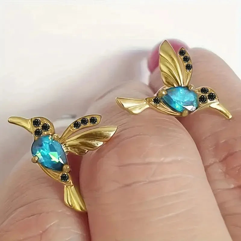 Bird hanging earrings with zirconium wings in long drop style