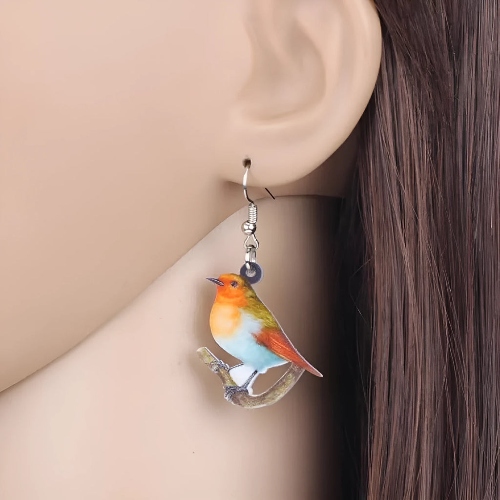 Blue titmouse acrylic pendant earrings with geometric animal zodiac and snake design elements