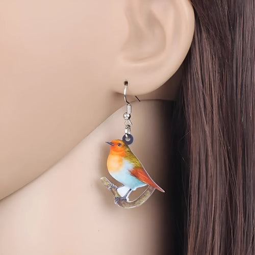 Blue titmouse acrylic pendant earrings with geometric animal zodiac and snake design elements