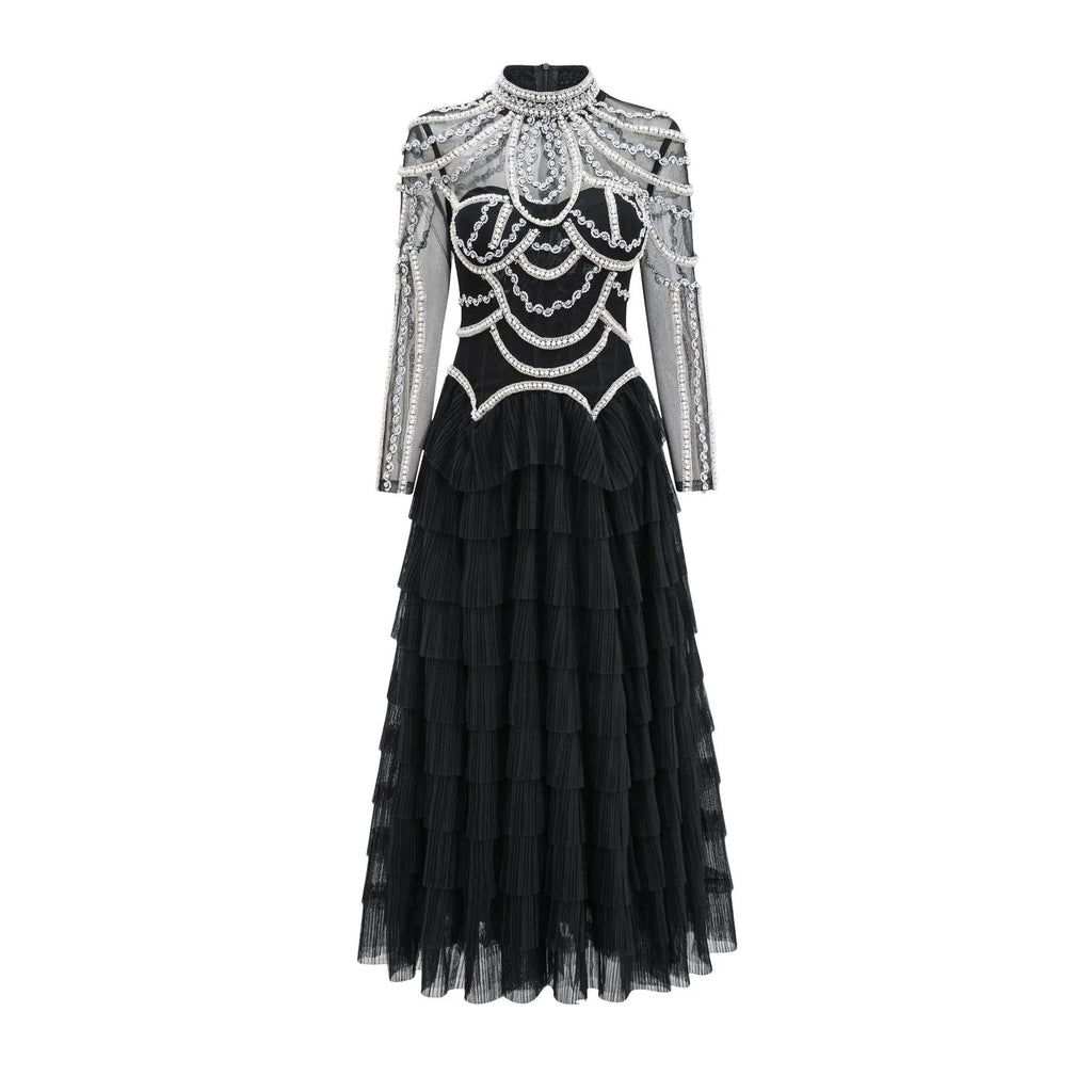 Black women's long sleeve formal dress with detailed beaded craftwork on the front.