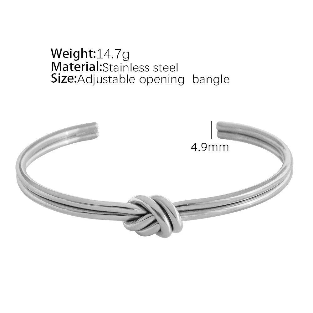 Adjustable C-shaped stainless steel bracelet with knotted double-layer design in gold or silver finish