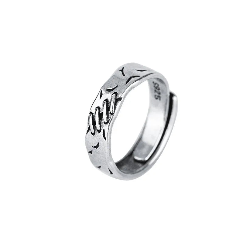 Geometric adjustable ring in matte black copper with round and oval design elements