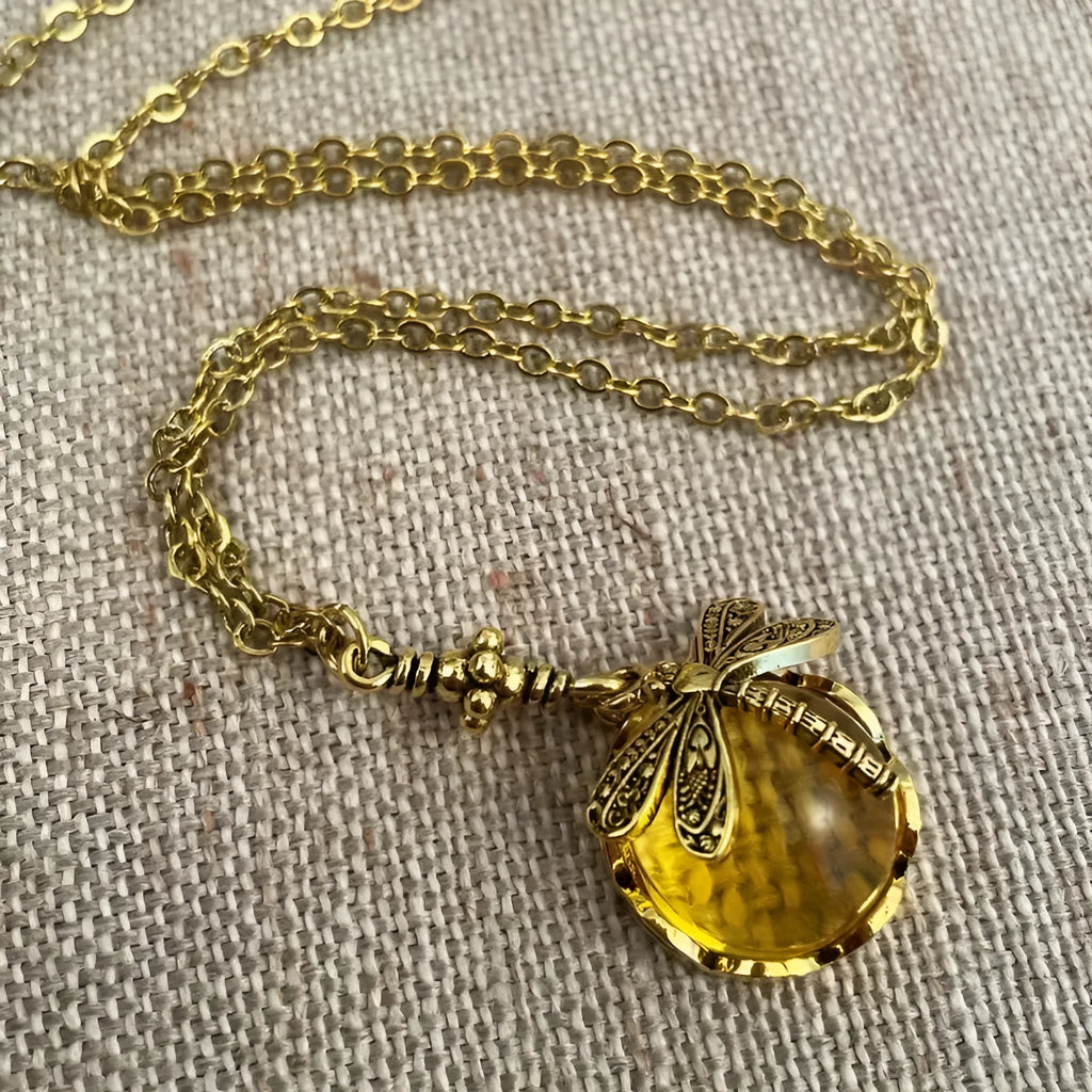 Hand carved dragonfly pendant necklace in vintage bronze finish on sterling silver chain