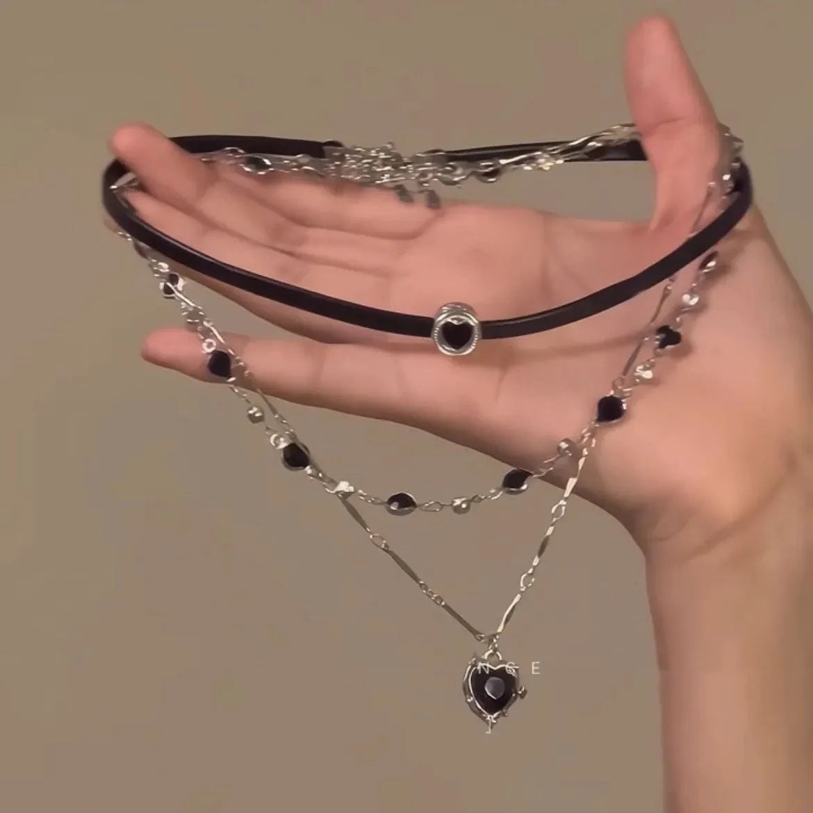 Women's creative multi-layer twin necklace set with heart-shaped leather and crystal pendants on adjustable chain