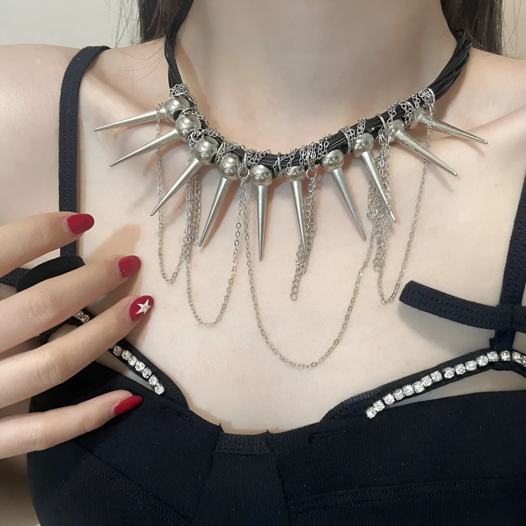 Women's leather necklace with winding rivet beads and a tassel in casual style.