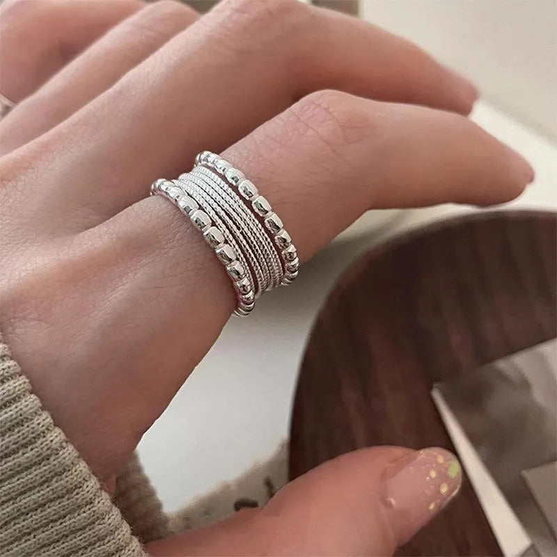 Women's copper alloy ring with woven twisted geometric design and adjustable opening