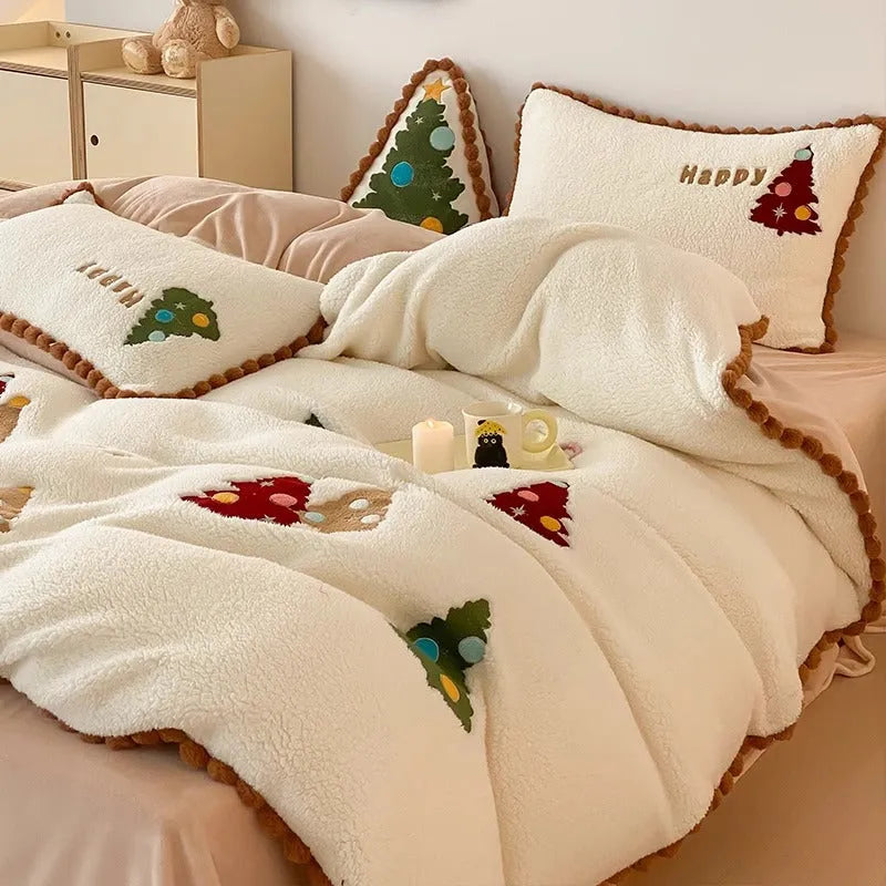 Bright yellow fleece-lined bedding set with embroidered cartoon Christmas tree pattern, including duvet cover, sheet, and pillowcases.