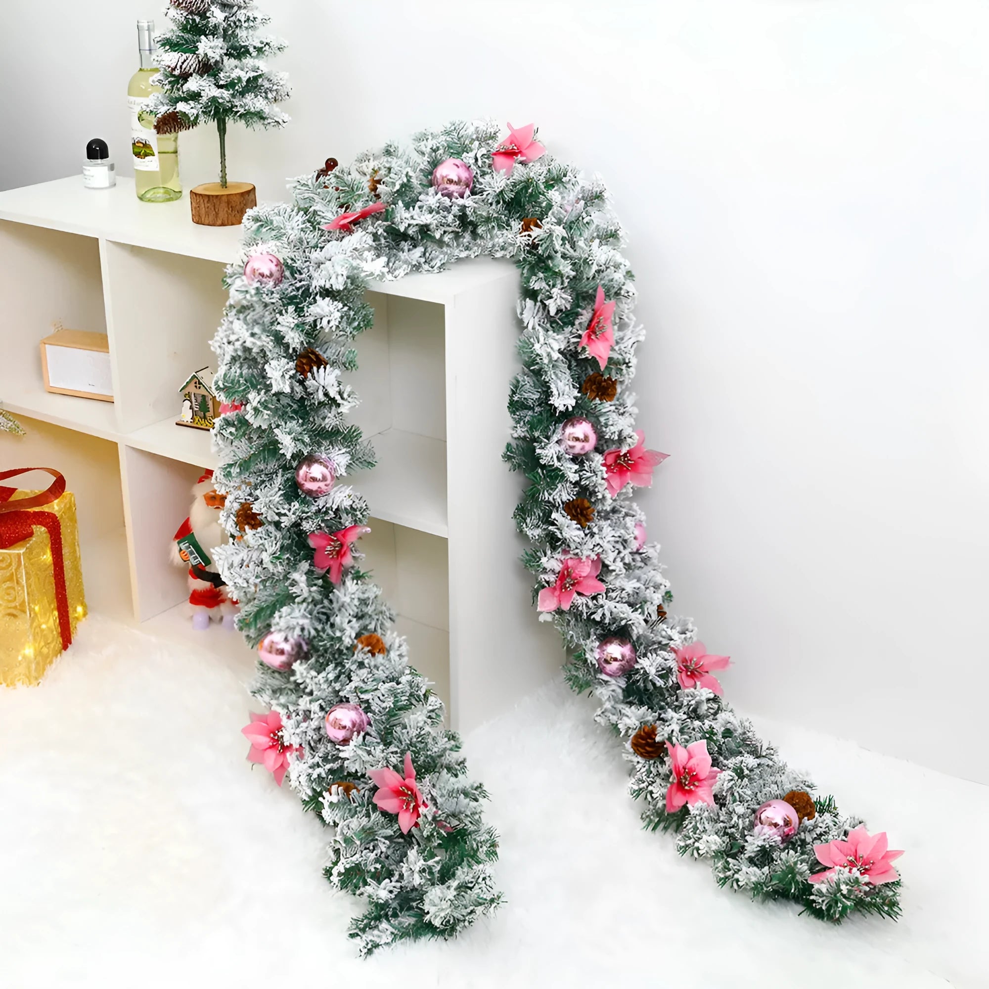 PVC rattan Christmas garland with flocked decoration in golden colour, draped along a mantle