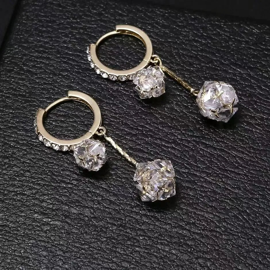 Silver tone clip-on earrings with tassel ball and rhinestone ball pendants in drop design