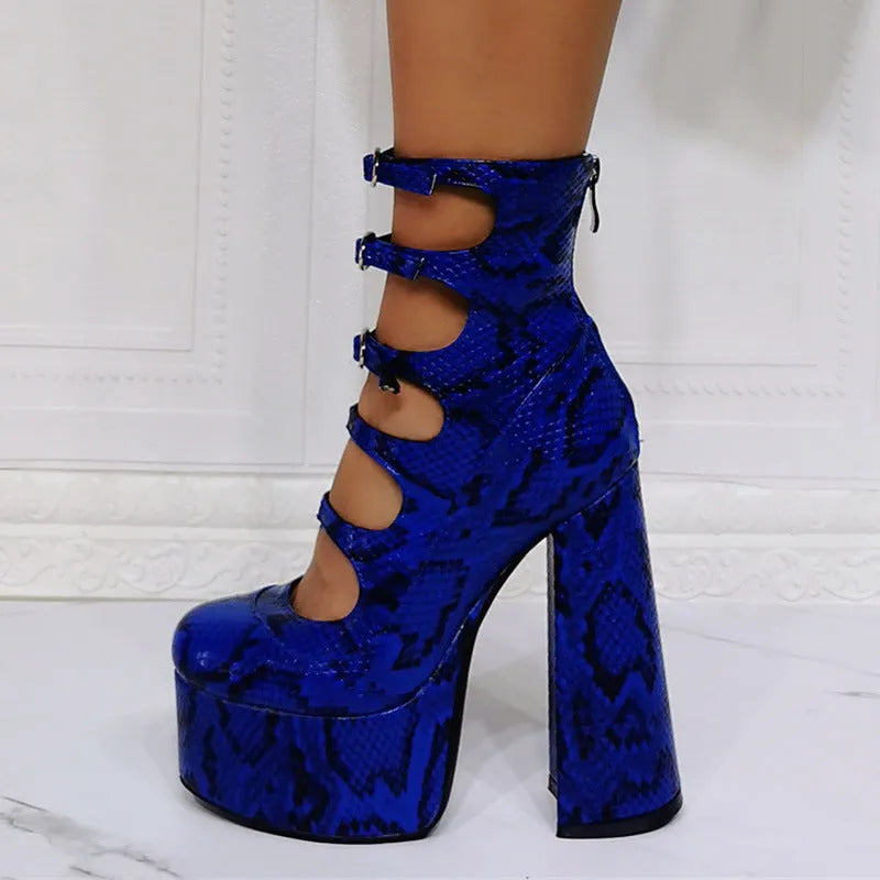 Black patent leather women's platform high heel boots with a thick heel and serpentine ankle buckle