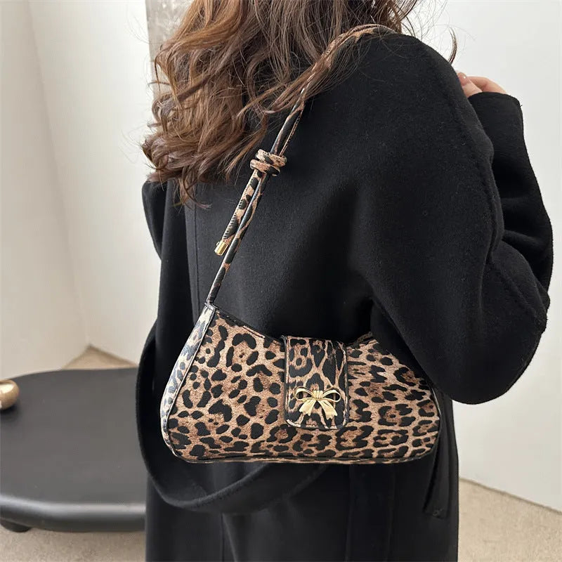Large casual PU handbag for women in black, shown with sandwich pocket detail.