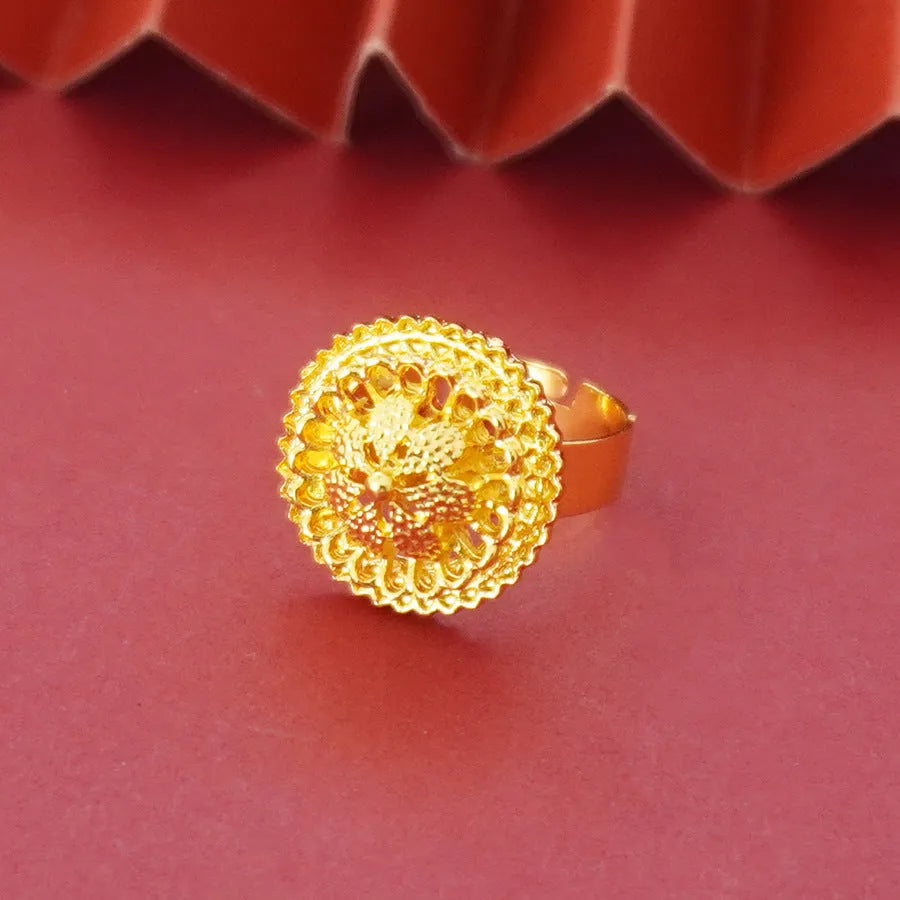 Gold-plated three-piece jewellery set with necklace, earrings, and ring in a floral design.