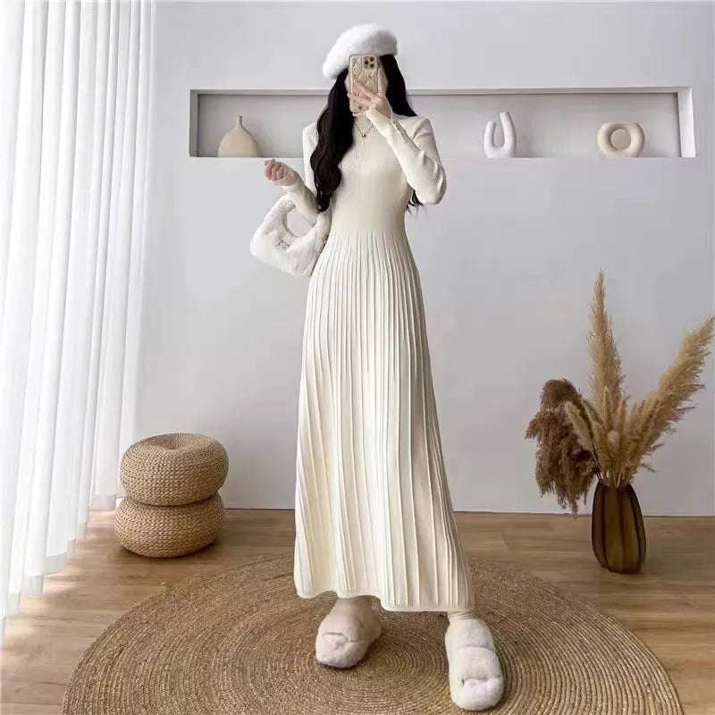 Women's beige knit A-line mid-length skirt with high waist trimming, shown front view.