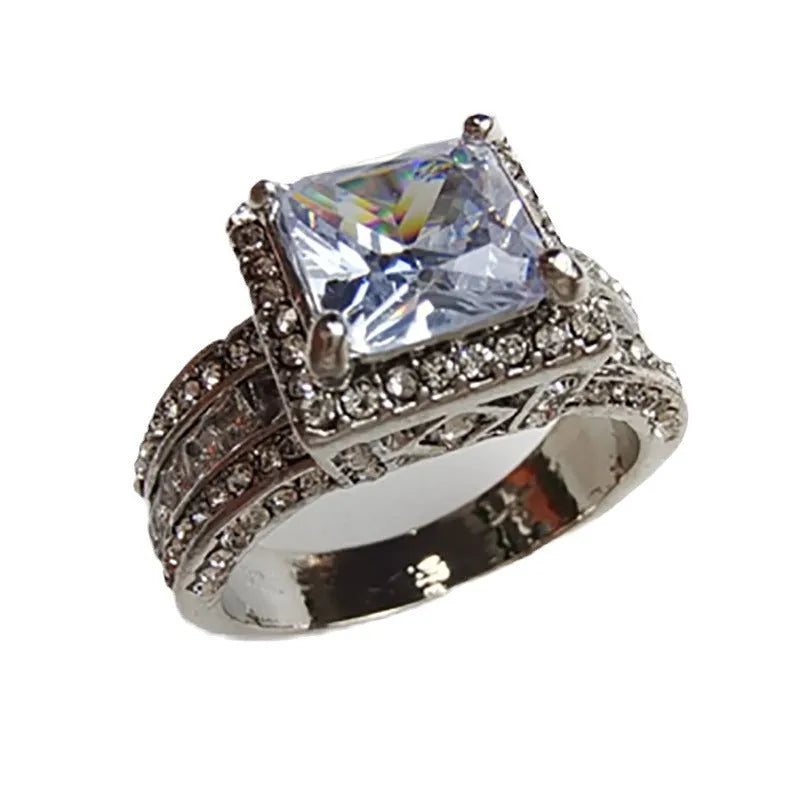 Geometric silver fashion ring for women in gold or white electroplated alloy, showing round design elements.