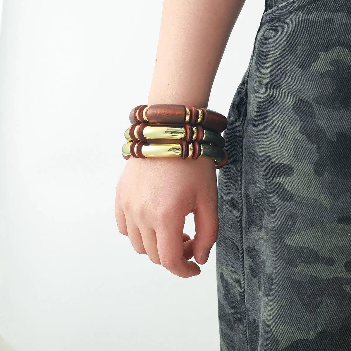 Women's multi-layer wooden necklace and bracelet set with alloy round pendant on regular chain