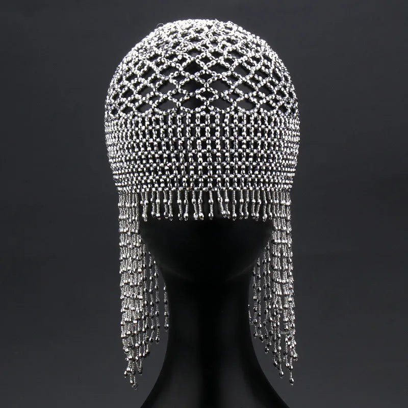 Handmade silver belly dance hat with beaded alloy tile and long black tassels.