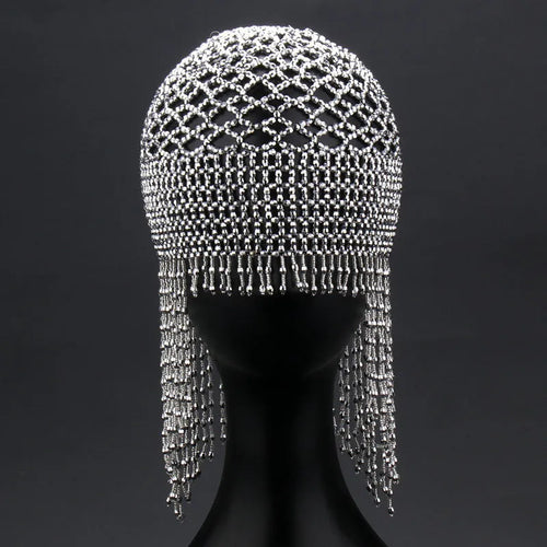 Handmade silver belly dance hat with beaded alloy tile and long black tassels.
